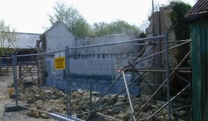 Rebuilding of wall using existing stone